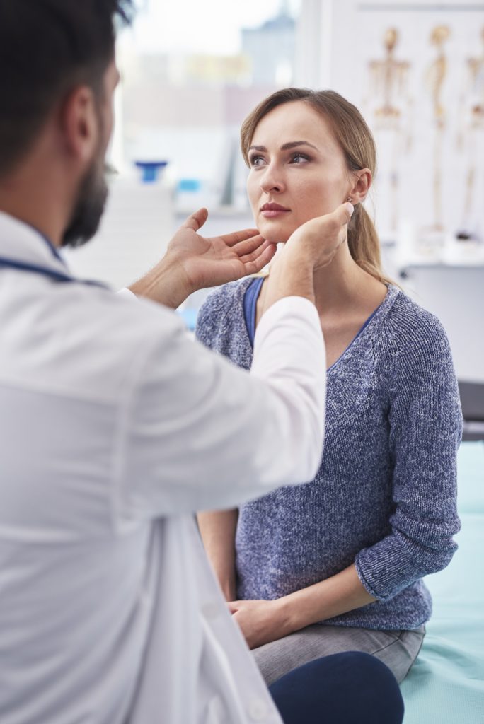 The doctor examines the patient